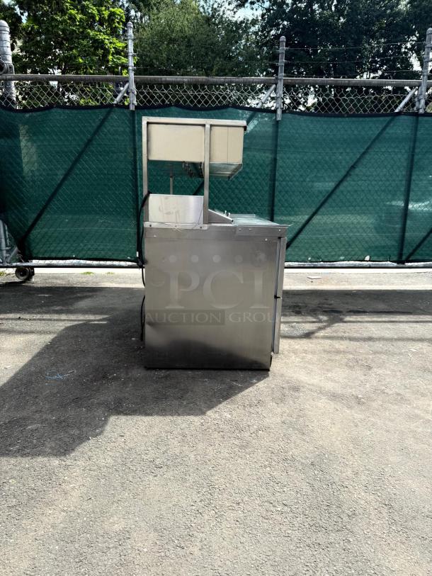 Delfield D4464NP refrigerated sandwich prep table, stainless steel, 4 drawers, mega top, 5" casters, good condition.