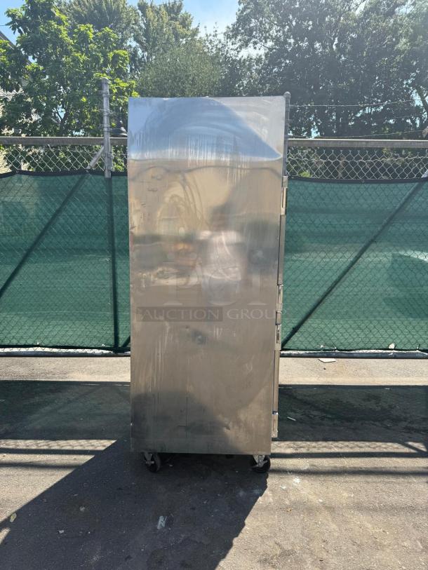 TRAULSEN RDT132WUT-HHS 29" dual temp refrigerator freezer; stainless steel, some surface wear, on casters for mobility.