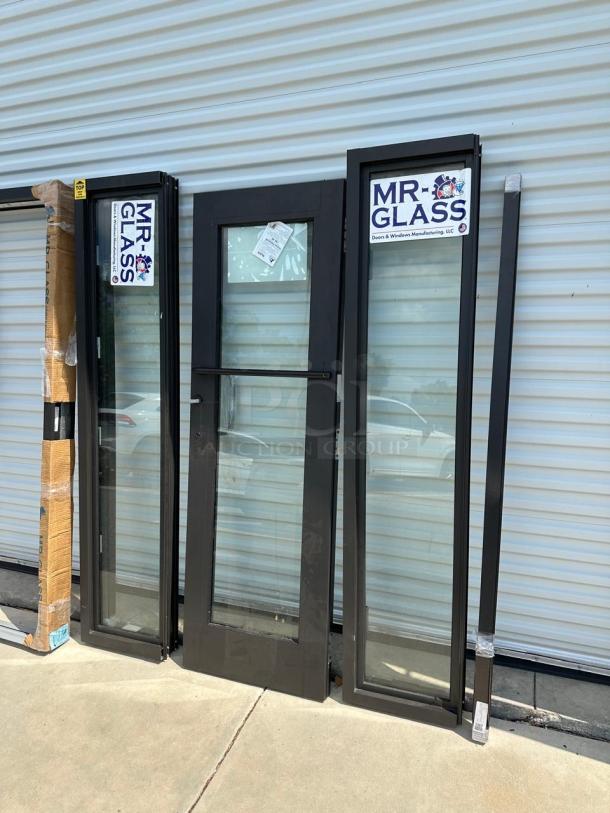 Mr. Glass doors and windows set. Various dimensions, black frames, clear glass. New condition with labels visible.