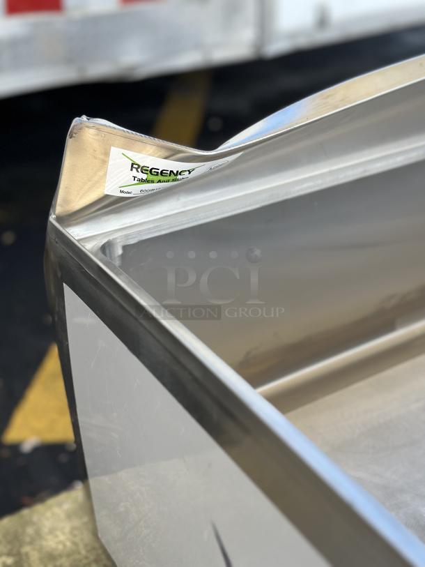 Brand new Regency 18" x 36" underbar ice bin, model 600IB1836CP, visible scratch and dent, with bottle holders.