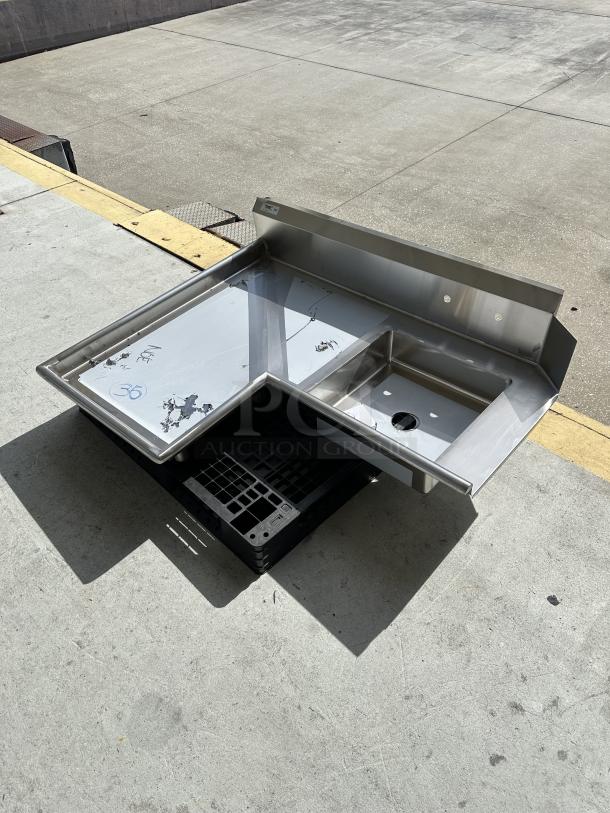 Brand new Regency 4' 16-gauge stainless steel soiled L-shape dishtable, model 600DDTI48L, with minor scratches and dents.