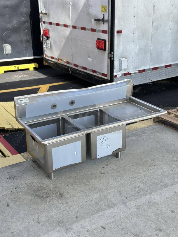 Brand new Regency sink component, model 600S2162018R, with right drainboard. Visible scratches and dents.