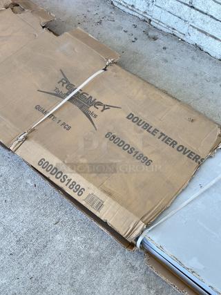 Regency stainless steel double deck overshelf, Model 600DOS1896, 18"x96"x32", new condition with scratches, in original packaging.