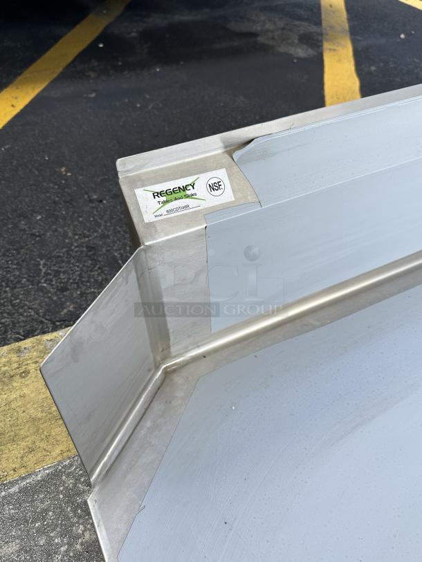 Regency 4' L-Shape Stainless Steel Dishtable, model 600CDTI48R, scratch and dent condition, NSF label visible.
