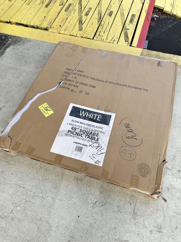 Brand new Lancaster Table & Seating 48" square picnic table with benches in original box; scratch and dent noted.