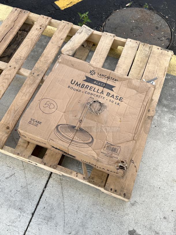Lancaster Table & Seating 50 lb. concrete umbrella base, model 427BASECNR50, black, brand new, scratch and dent damage.