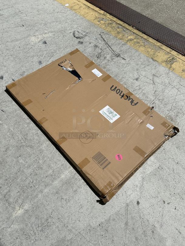 Cardboard box containing a Lancaster Table & Seating 30" x 48" laminated table top, slightly damaged. Model 3493048TCB visible.