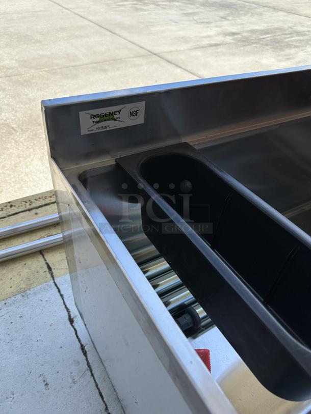 Regency 18"x36" underbar ice bin, model 600IB1836, new condition with scratch and dent, NSF certified label visible.