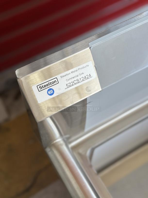 Steelton 522CS12424 stainless steel commercial sink, new condition, 29 1/2" size, single bowl, NSF label visible.