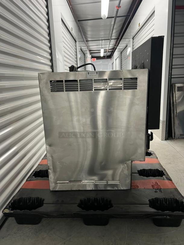 Frozen Beverage Dispenser, 77X Series, stainless steel, visible rear vents, placed on a pallet, good condition.