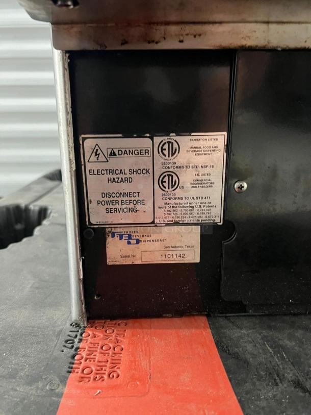 Frozen Beverage Dispenser, 77X Series, labels showing ETL certification, electrical hazard warning, and serial number 1101142.