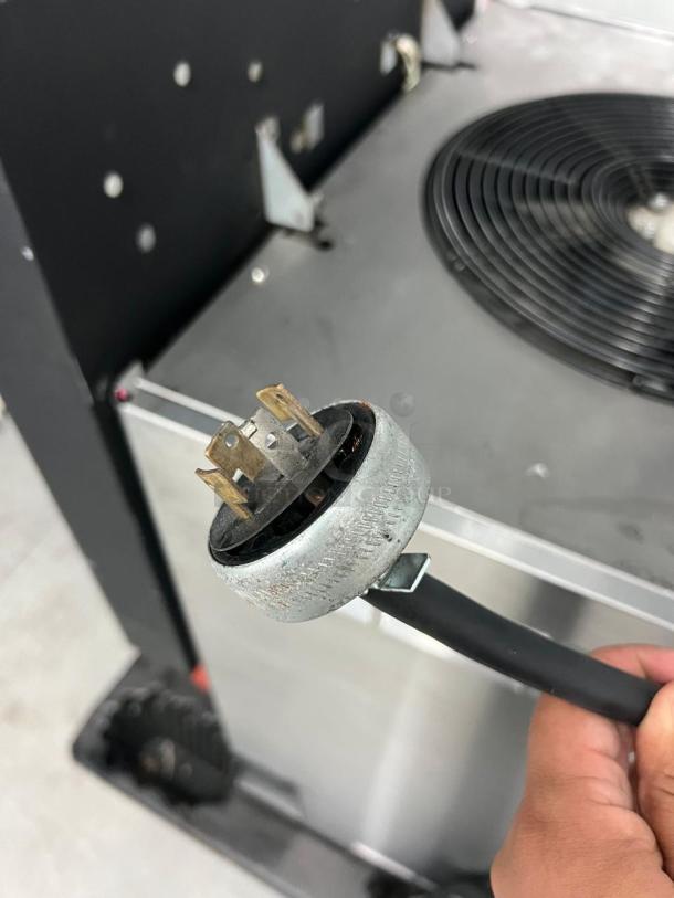 Frozen Beverage Dispenser, 77X Series, in good condition. Features power connector, visible cooling fan, and metal casing.