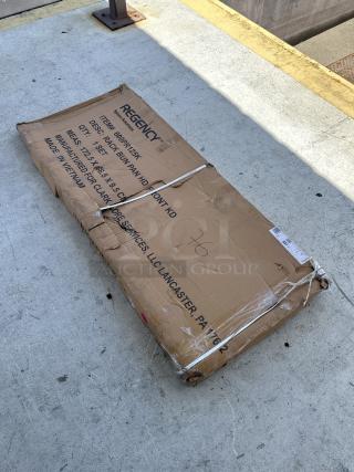 Regency 600PR125K 12 Pan End Load Bun/Sheet Pan Rack, scratch and dent, unassembled in original packaging.