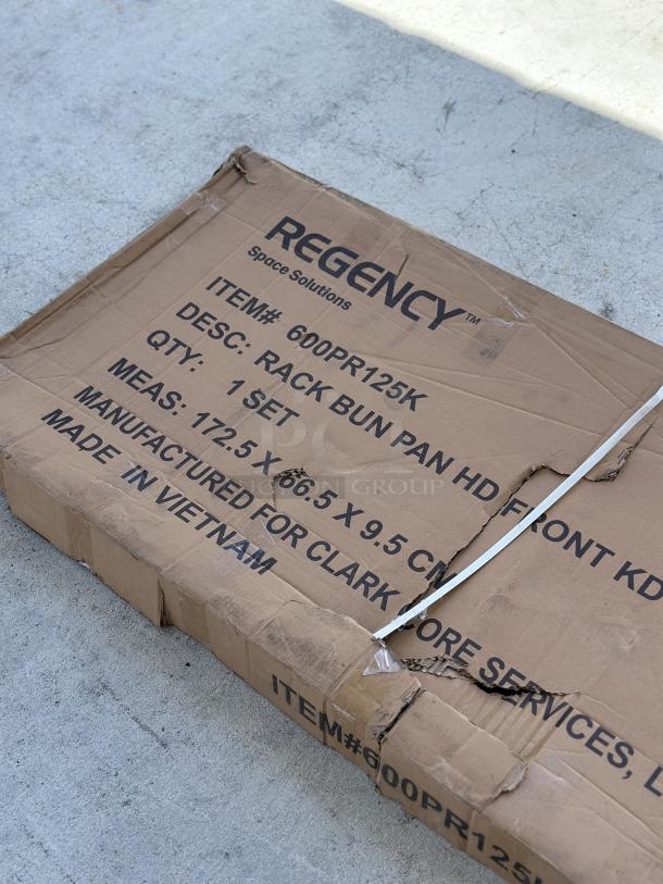 Regency model 600PR125K 12-pan sheet pan rack in original packaging, new with visible box wear.
