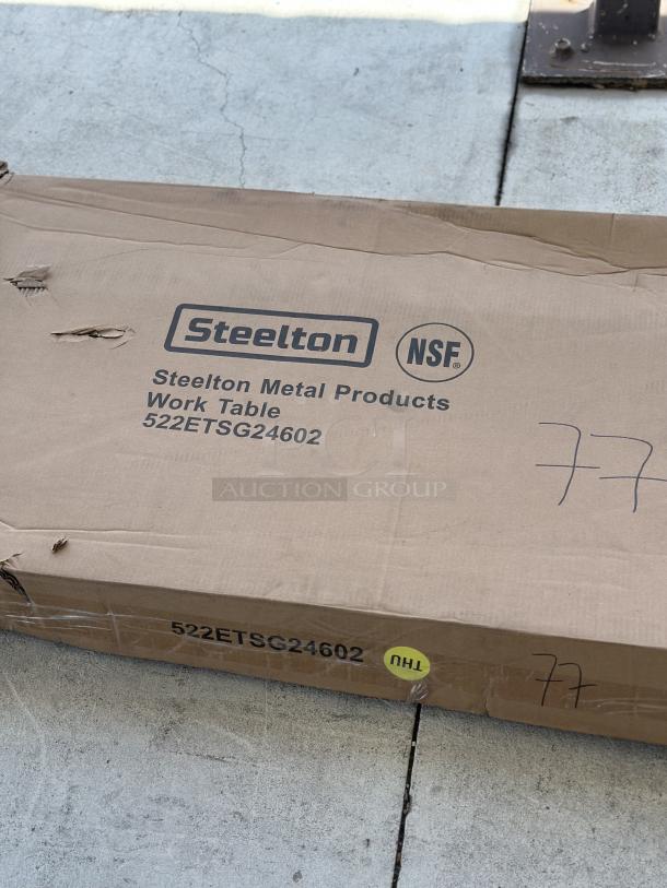 Steelton 24"x60" stainless steel work table in box, model 522ETSG24602. New, scratch and dent condition.