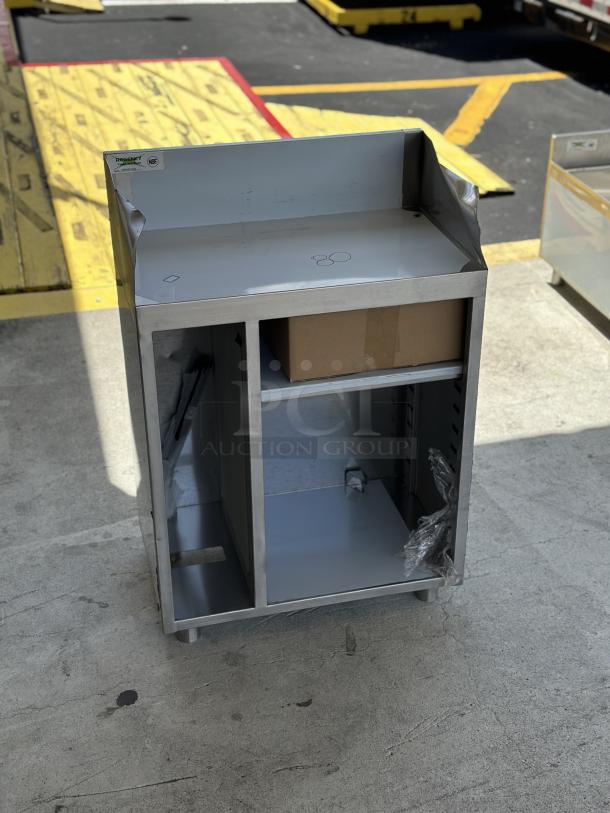 Regency 24" stainless steel bussing station, model 600WST1524, new with visible scratches and dents, pan holder included.