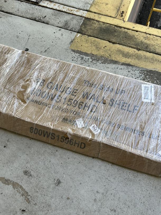 Regency heavy-duty wall shelf, model 600WS1596HD, 15"x96", new with scratches, in original packaging. Stainless steel.