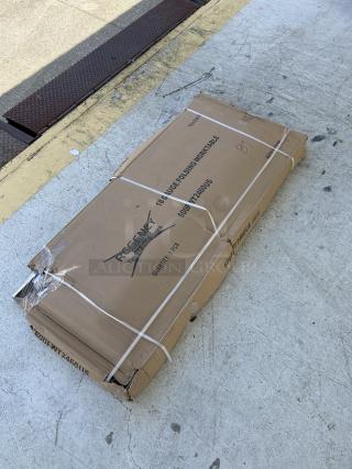 Regency 24"x60" stainless steel folding work table, model 600FWT246OUS, new with scratch and dent, boxed.