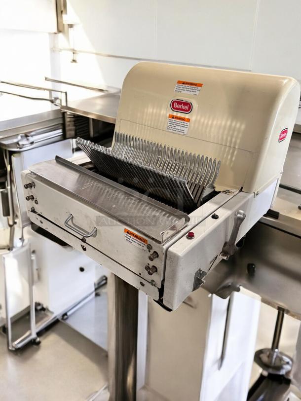 Berkel MB 1/2 bread slicer, excellent condition, 115V, fully tested. Features safety warnings and Berkel logo visible.