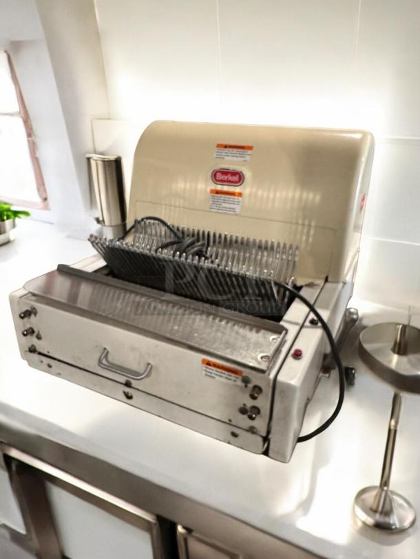 Berkel MB 1/2 bread slicer in excellent condition, 115V, fully tested, with visible branding and safety labels.