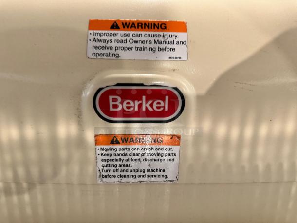 Berkel MB 1/2 bread slicer in excellent condition, fully tested and working. Red Berkel logo and safety warnings visible.