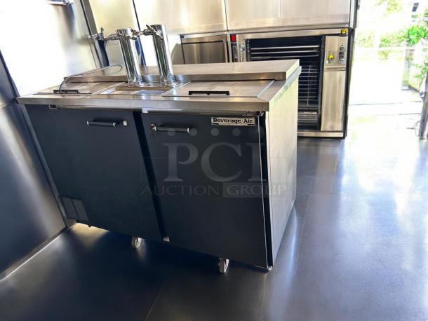 Beverage-Air DD58C draft beer dispenser, excellent condition, 115V, two taps, brand label visible, on wheels.