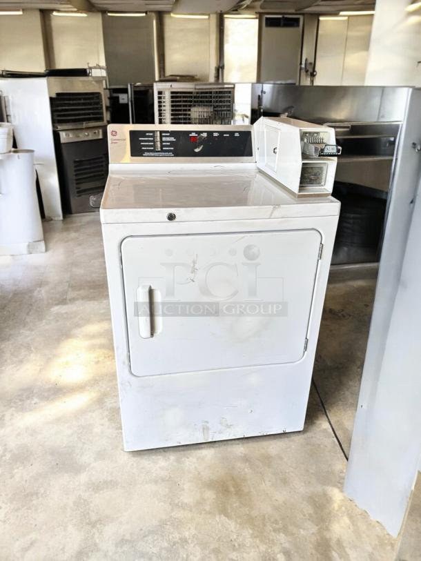 GE DCCD330ED2WC commercial electric dryer, 240V, excellent condition, fully tested, coin-operated with visible control panel.