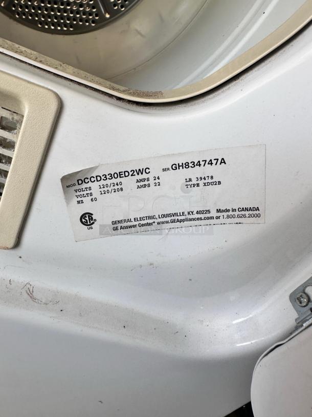 GE DCCD330ED2WC commercial electric dryer in excellent condition, 240V, fully tested and working, model and serial labels visible.