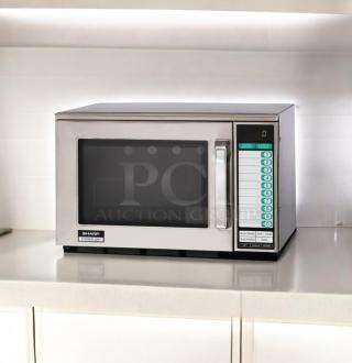 Sharp R-23GT-F commercial microwave oven in excellent condition, 208/230V, fully tested, stainless steel exterior, keypad controls.