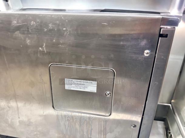 Sharp R-23GT-F commercial microwave oven, stainless steel, excellent condition, 208/230V, warning label visible, fully tested.
