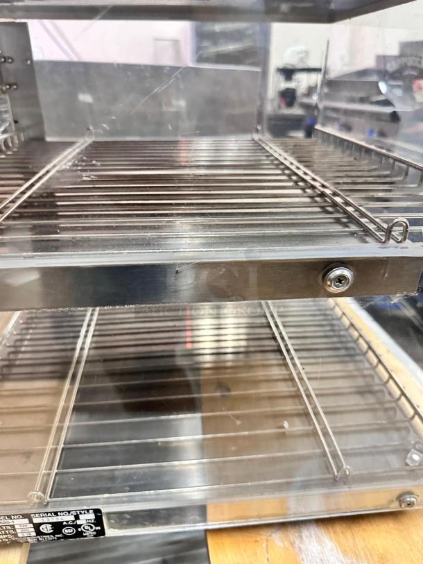 Wisco 680-1 food warmer/display cabinet in excellent condition, stainless steel racks, fully tested, 120V label visible.