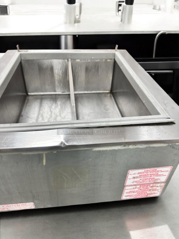 Wisco 680-1 countertop merchandising warmer, excellent condition, 120V, stainless steel, visible caution label.