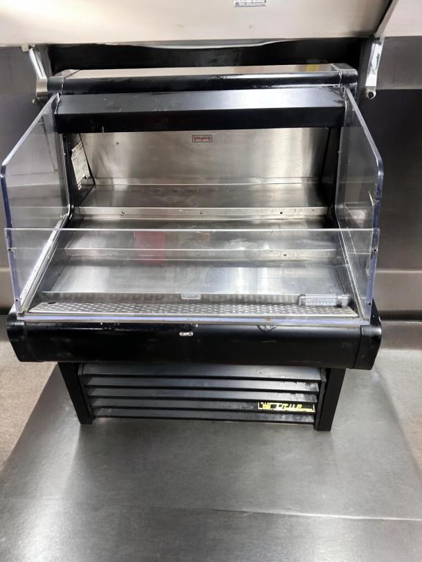 True THAC-36 refrigerated air curtain merchandiser in excellent condition, fully tested, with clear front and stainless interior.