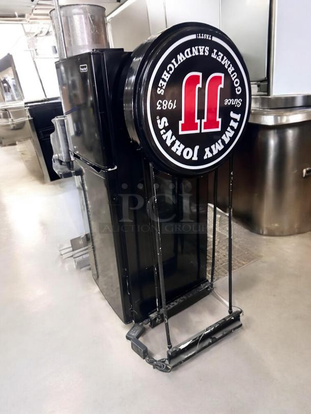 Double-sided LED Jimmy John’s sign by Magic Color, 25" diameter, 5' tall, excellent condition, fully tested and working.