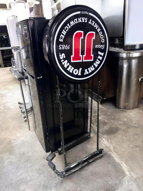 Double-sided LED Jimmy John’s sign by Magic Color, 25" diameter, 5' tall, excellent condition, fully tested and working.