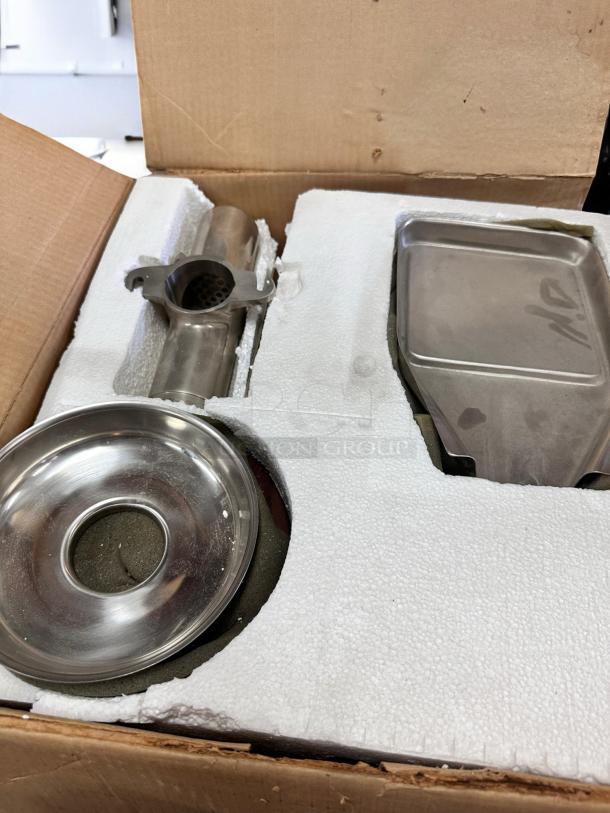 Brand new Norwalk Model 235 hydraulic press juicer in original packaging, 110V, components visible in foam insert.