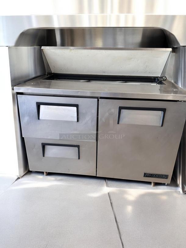 True TSSU-48-12D-2 sandwich/salad prep table, 48", stainless steel, excellent condition, two drawers, 115V, tested and working.
