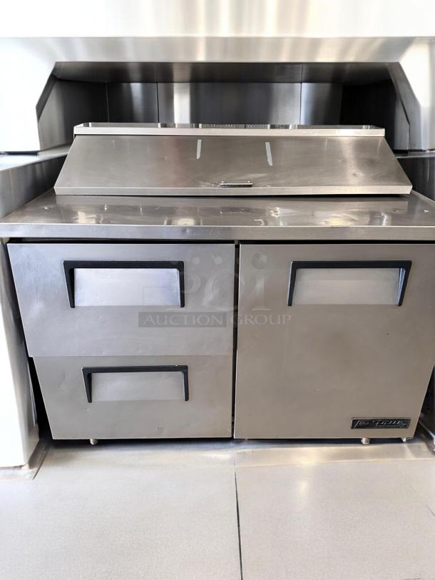 True TSSU-48-12D-2 prep table, excellent condition, 48" wide, stainless steel, dual drawers, 115V, fully tested, brand logo visible.