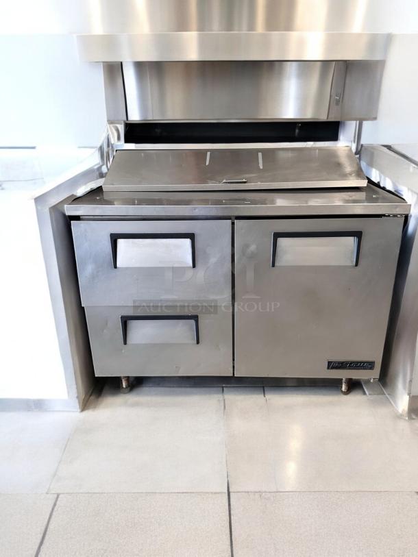 True TSSU-48-12D-2 sandwich prep table, 48", excellent condition, stainless steel, fully tested, 115V.
