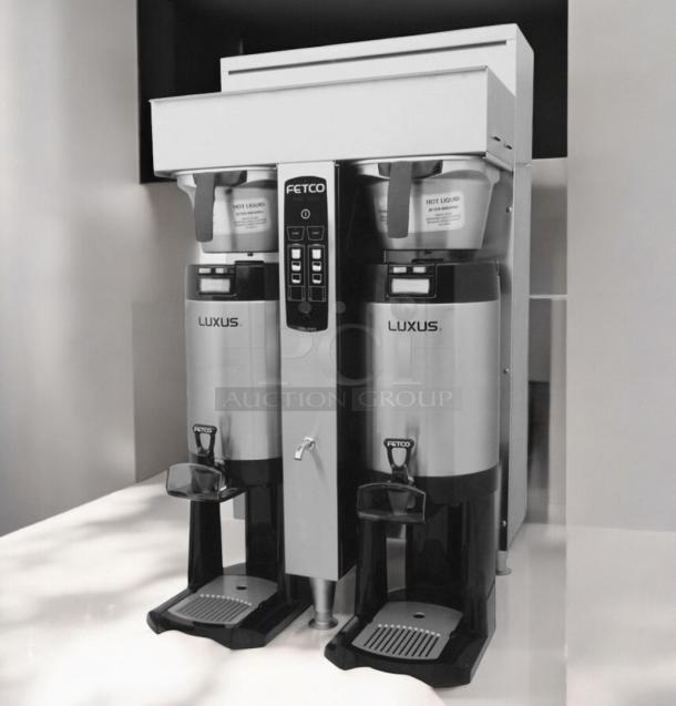 Fetco CBS-2052e dual station coffee brewer in excellent condition, fully tested and working, 208-240V, stainless steel.