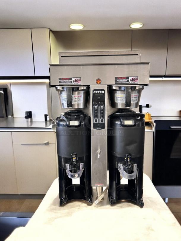 Fetco CBS-2052e Dual Station Coffee Brewer, excellent condition, fully tested, 208-240V, stainless steel, dual dispensers.