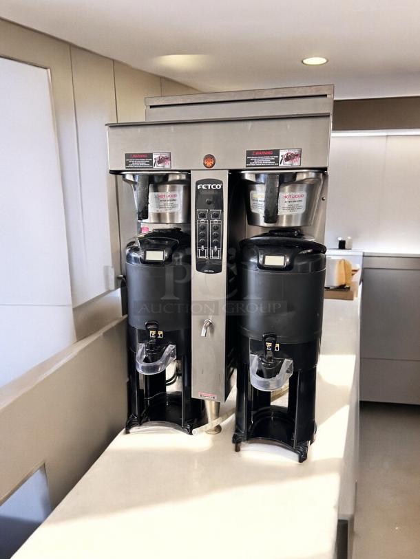 Fetco CBS-2052e Dual Station Coffee Brewer, excellent condition, fully tested, 208-240V, stainless steel finish.