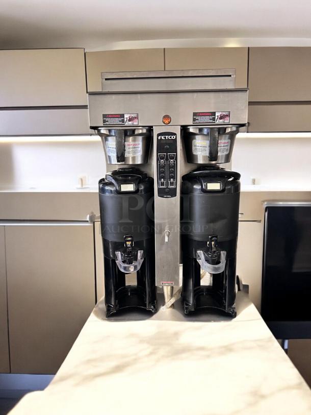 Fetco CBS-2052e dual station coffee brewer in excellent condition, 208-240V, fully tested and working, with visible control panel.