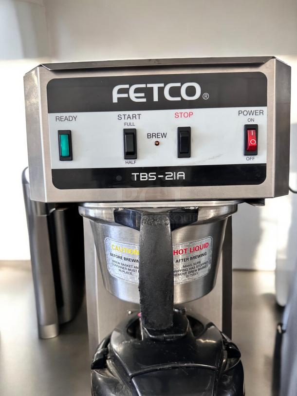Fetco TBS-21A tea brewer in excellent condition, features controls for starting, stopping, and brewing. Fully tested and working.