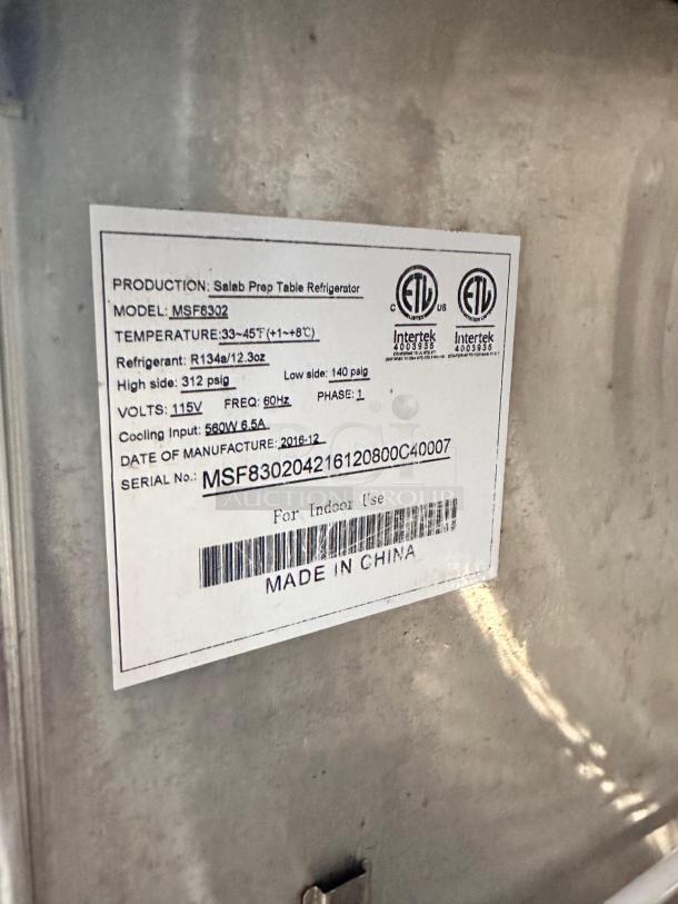 Label of Atosa MSF8302 two-door salad prep table refrigerator, showing production details, voltage, and refrigerant info.