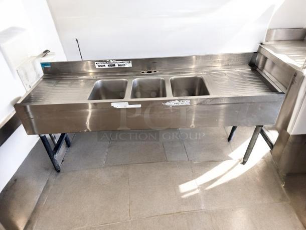 Stainless steel 3-compartment bar sink with dual drainboards, 72"x24"x35", excellent condition, fully tested.