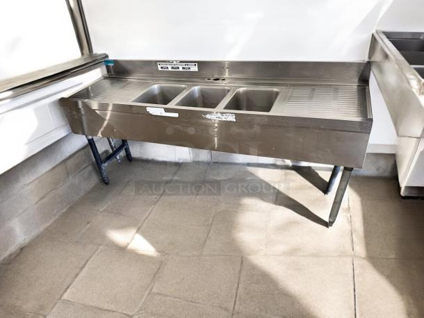 3-compartment stainless steel bar sink with dual drainboards, 72"x24"x35", excellent condition, fully tested and working.