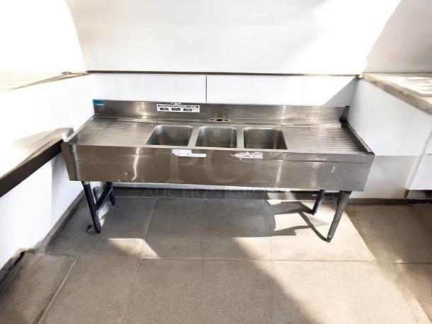 Excellent condition 3-compartment stainless steel bar sink with dual drainboards, 72"x24"x35", fully tested and working.
