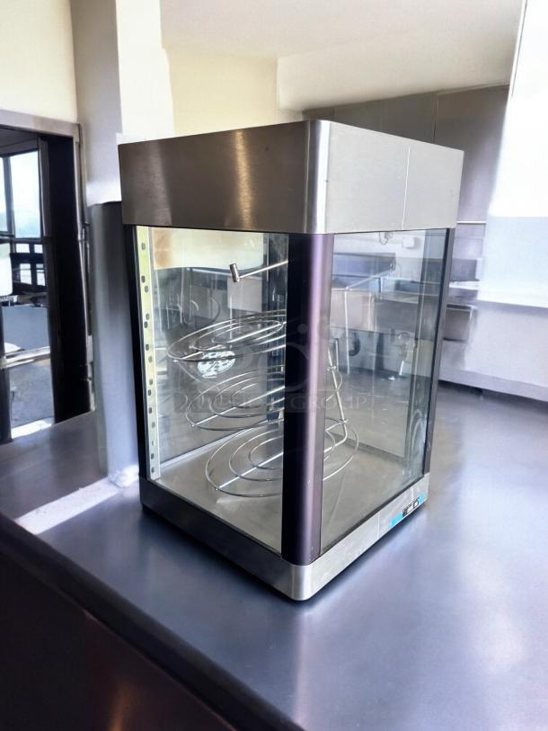 Star HFD-2A heated display cabinet, excellent condition, rotating racks, stainless steel, fully tested, 120V.