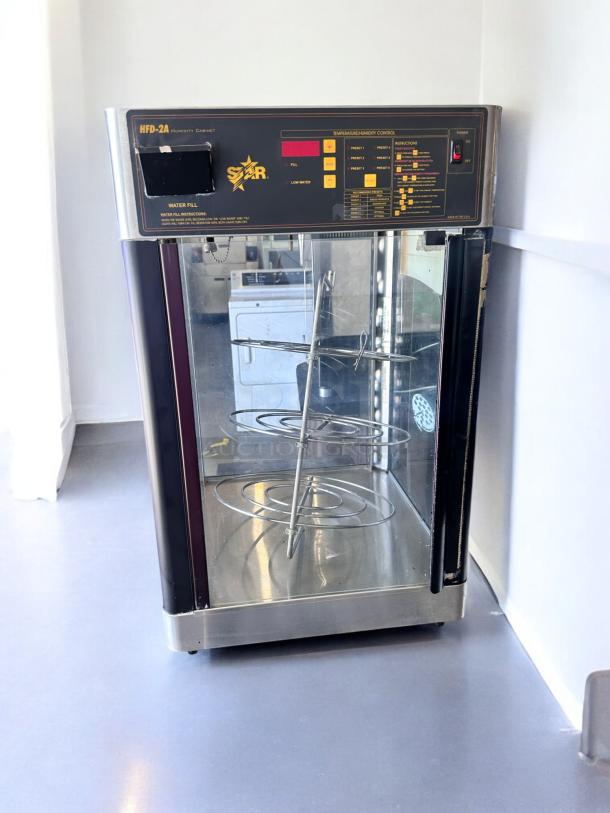 Star HFD-2A heated display cabinet with rotating racks, excellent condition, 120V, fully tested, temperature control panel.